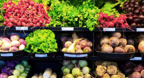 grocery store shelves with vegetables