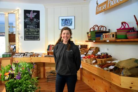 Hannah Flanders stands in their local food marketplace Sweet Beet Market.