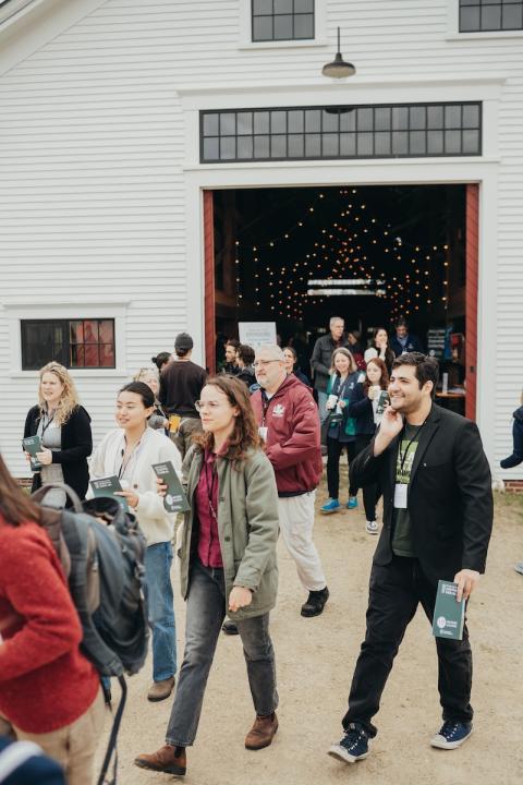 people walking out of a barn at the 2025 statewide gathering